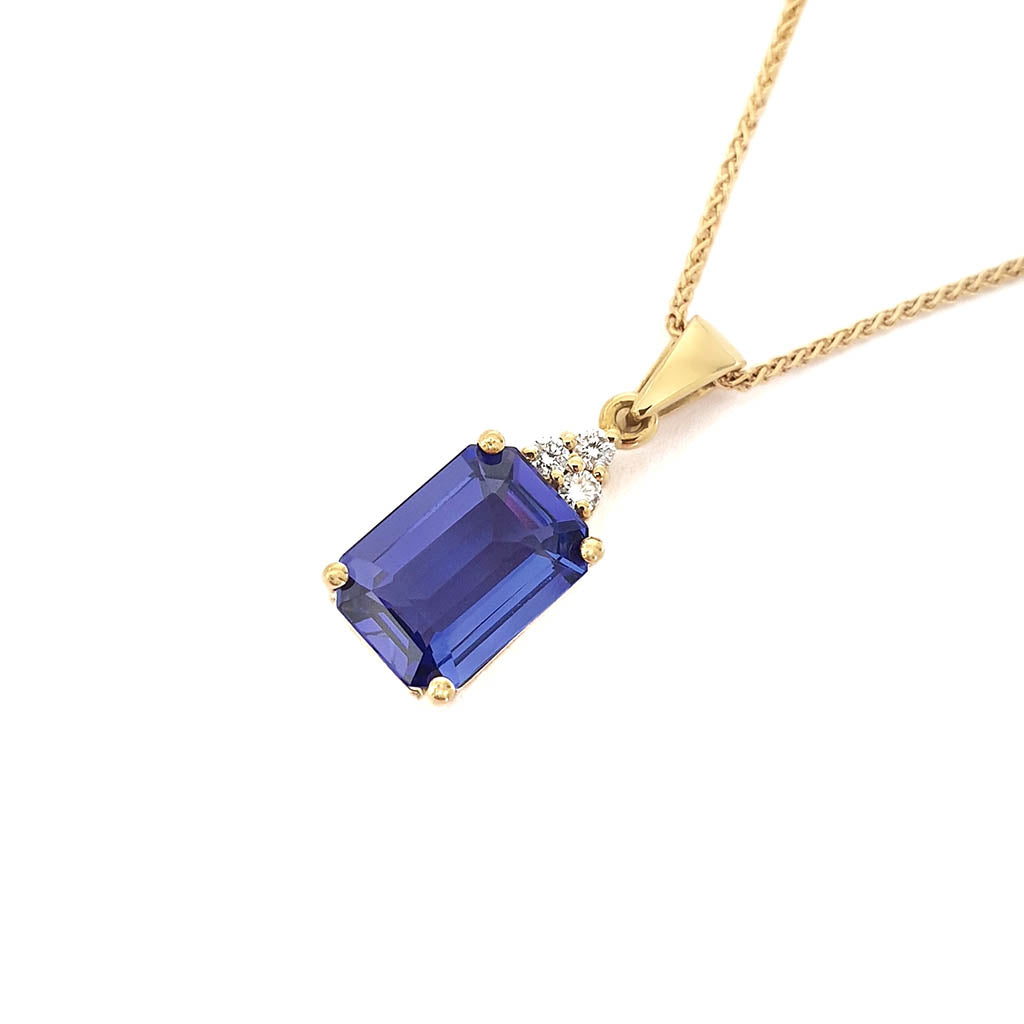 Handcrafted Emerald Cut Tanzanite Yellow Gold Pendant with Diamond Trilogy Detail