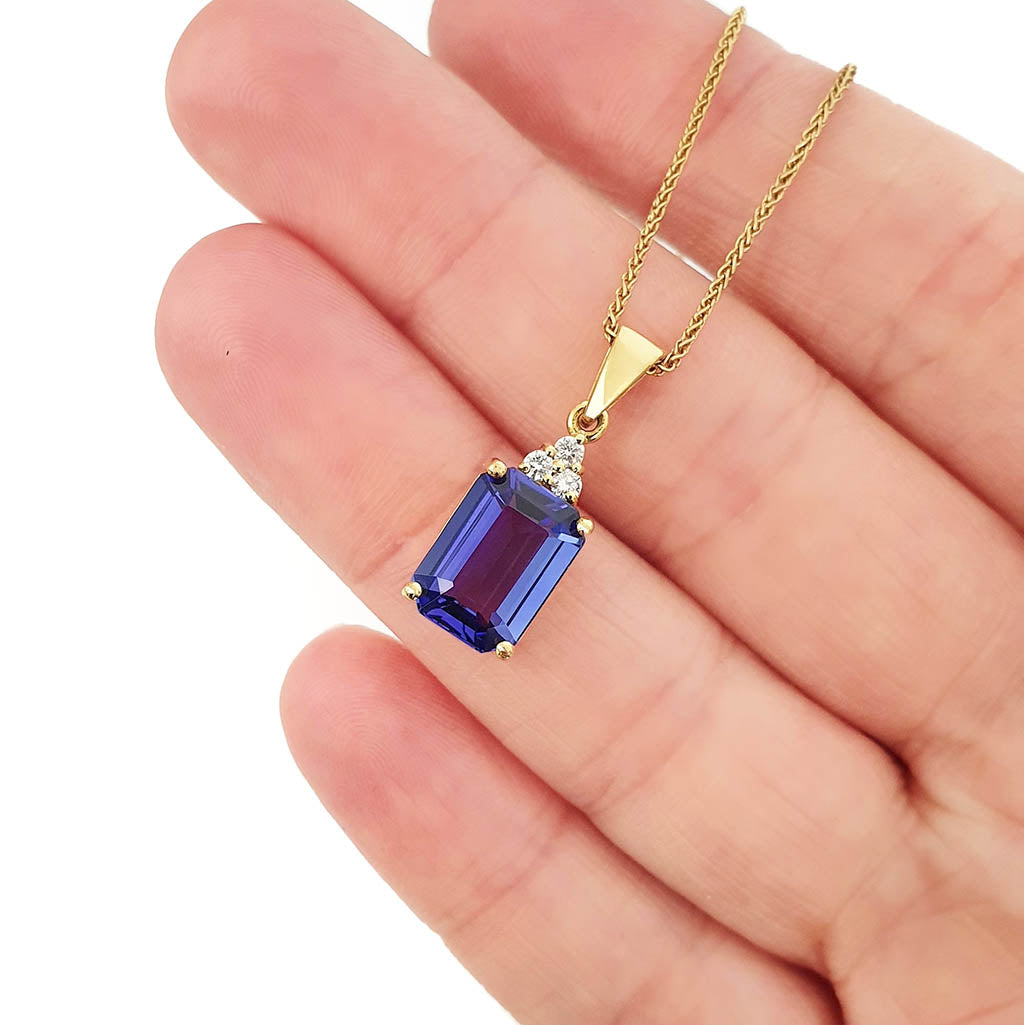 Handcrafted Emerald Cut Tanzanite Yellow Gold Pendant with Diamond Trilogy Detail