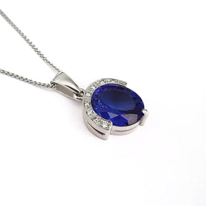 Handcrafted Oval Cut Tanzanite Pendant with Flush Set Diamond Accents