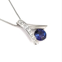 Handcrafted Tanzanite with Eight Diamond Ribbon Pendant