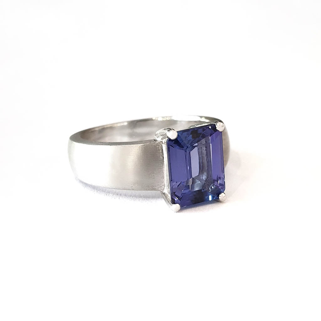 Handcrafted Unisex Emerald Cut Tanzanite Ring with Brushed Band Detail