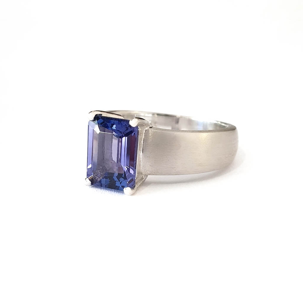 Handcrafted Unisex Emerald Cut Tanzanite Ring with Brushed Band Detail