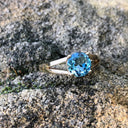 Solitaitre Round Cut and Claw Blue Topaz Yellow Gold Ring