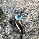 Solitaitre Round Cut and Claw Blue Topaz Yellow Gold Ring
