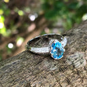Pear Cut Blue Topaz White Gold Ring with Diamond Band Accent