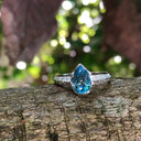 Pear Cut Blue Topaz White Gold Ring with Diamond Band Accent