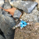 Trilliant Cut Blue Topaz With Diamond Point Accents