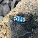 Landscape Set Oval Blue Topaz and Diamond ring
