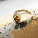 Trilliant Cut Citrine with Twisted Yellow Gold Band