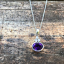 Oval Cut Amethyst with Trilogy Accent Pendant and Chain