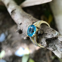 Majestic Round Cut Blue Topaz and Diamond Split Shank Ring