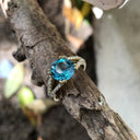 Majestic Round Cut Blue Topaz and Diamond Split Shank Ring