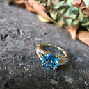 Majestic Round Cut Blue Topaz and Diamond Split Shank Ring