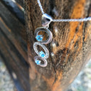 Blue Topaz and Diamond Circle Pendant