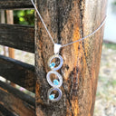 Blue Topaz and Diamond Circle Pendant