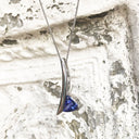 Handcrafted Trilliant-Cut Tanzanite Swish Pendant