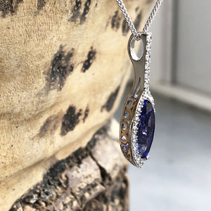 Marquise-Cut Tanzanite, Diamond Halo and Pavé Bale Pendant