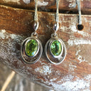 Oval Cut Peridot Circular Detail Drop Earrings
