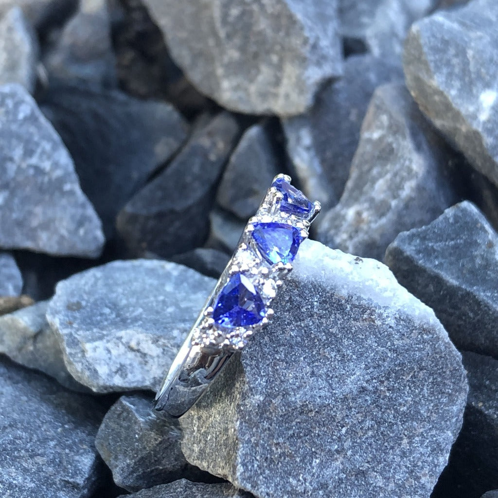 Three Trilliant Cut Tanzanite with diamond accent ring