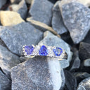 Three Trilliant Cut Tanzanite with diamond accent ring