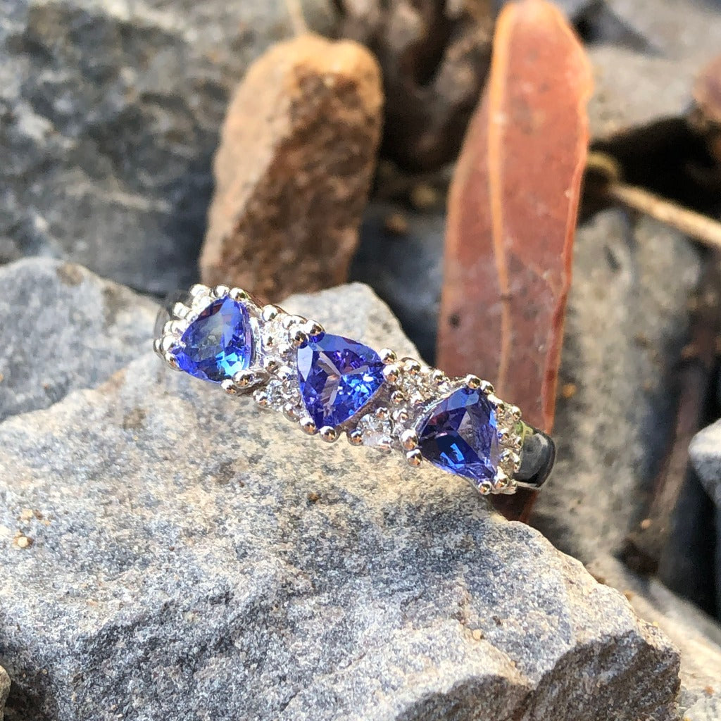 Three Trilliant Cut Tanzanite with diamond accent ring