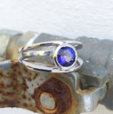Tube Set Solitaire Tanzanite Set in a White Gold Split Shank Ring