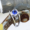 Tube Set Solitaire Tanzanite Set in a White Gold Split Shank Ring