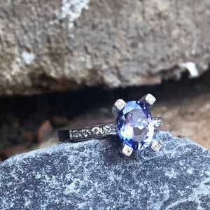 Oval-Cut Solitaire Tanzanite Ring with Diamond Claw and Band Accents