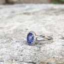 Oval Cut Tanzanite with Diamond Halo and Split Shoulder Ring