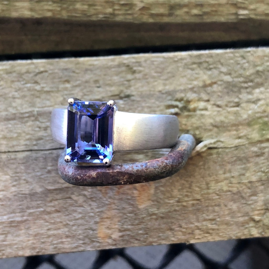 Handcrafted Unisex Emerald Cut Tanzanite Ring with Brushed Band Detail