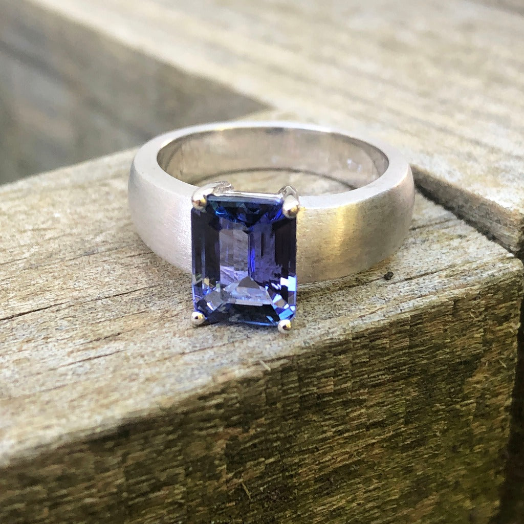 Handcrafted Unisex Emerald Cut Tanzanite Ring with Brushed Band Detail