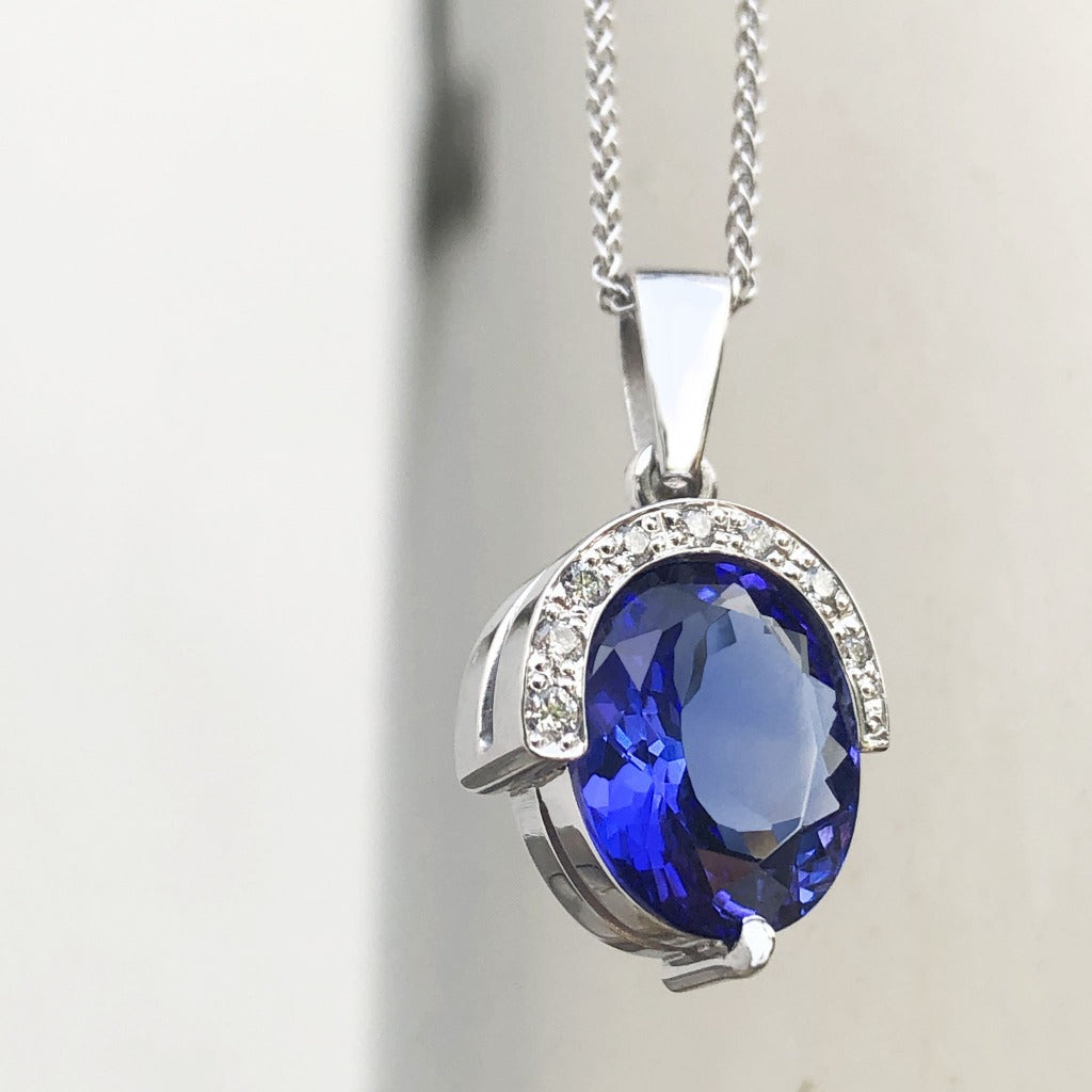 Handcrafted Oval Cut Tanzanite Pendant with Flush Set Diamond Accents