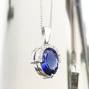 Handcrafted Oval Cut Tanzanite Pendant with Flush Set Diamond Accents