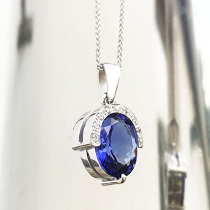Handcrafted Oval Cut Tanzanite Pendant with Flush Set Diamond Accents