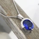Handcrafted Oval Cut Tanzanite Pendant with Flush Set Diamond Accents