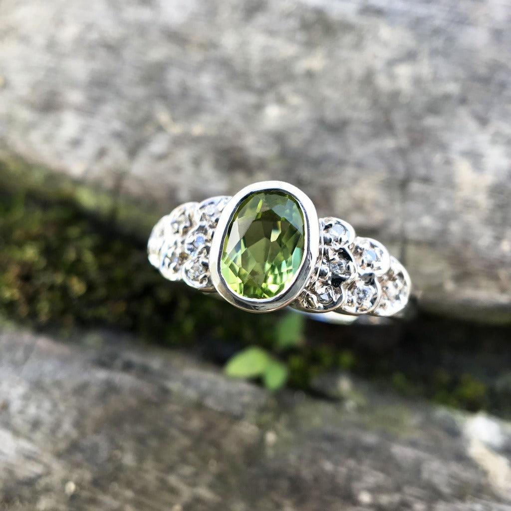 Ornate Oval Cut Peridot Ring with Diamond Step Detail