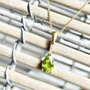 Pear Cut Peridot and Accent Diamond Drop Pendant