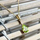 Pear Cut Peridot and Accent Diamond Drop Pendant