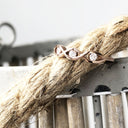 Twisted Rose Gold and Diamond Wedding Band