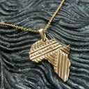 Patterned Solid Gold Africa Pendant