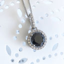 Round Cut Black Diamond Pendant with White Diamond Halo