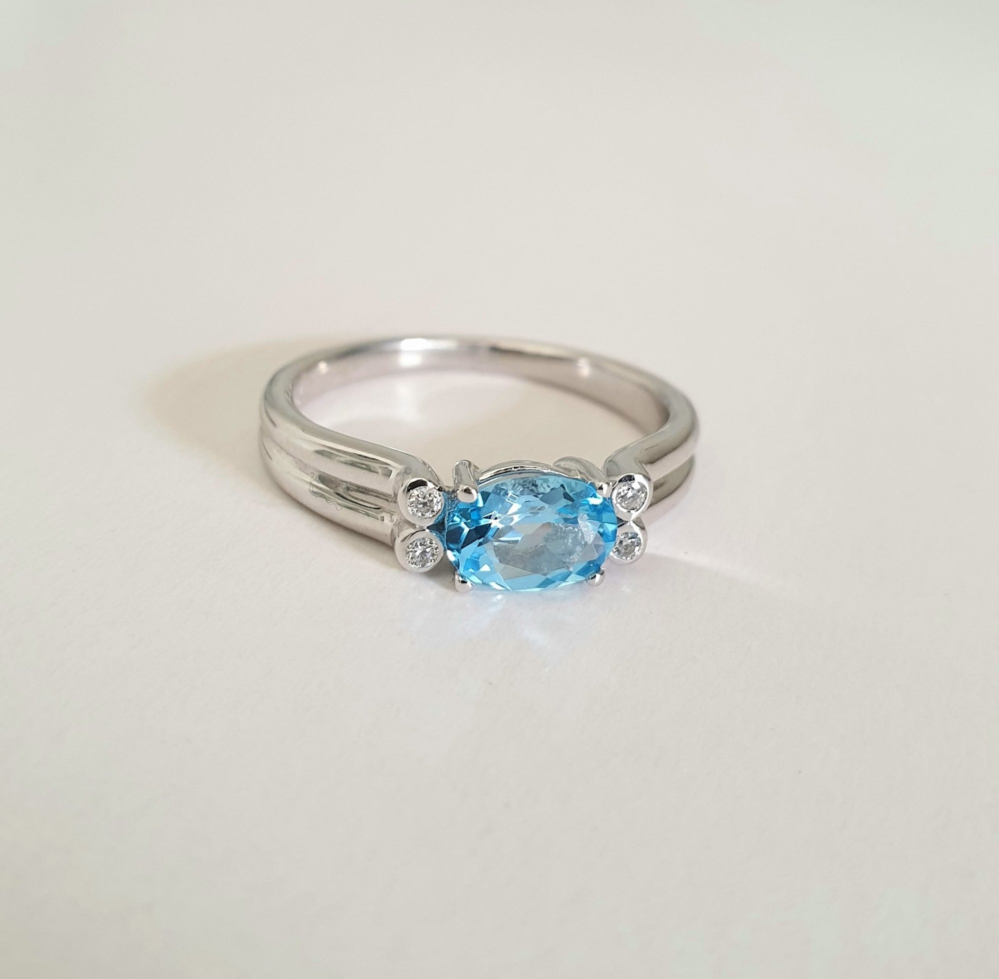 Landscape Set Oval Blue Topaz and Diamond ring