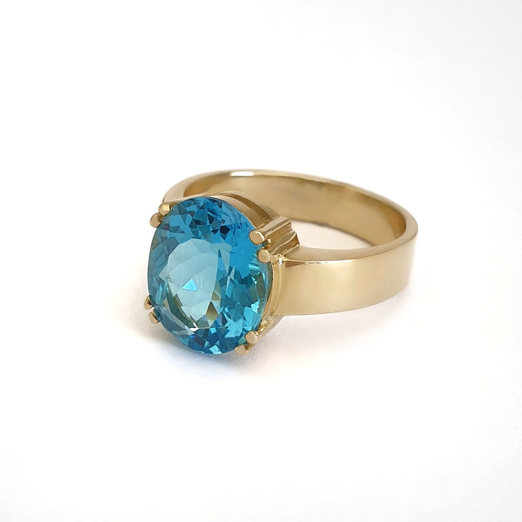 Large Oval Cut Blue Topaz And Yellow Gold Ring