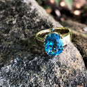 Large Oval Cut Blue Topaz And Yellow Gold Ring