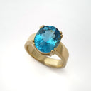 Large Oval Cut Blue Topaz And Yellow Gold Ring