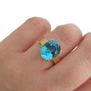 Large Oval Cut Blue Topaz And Yellow Gold Ring