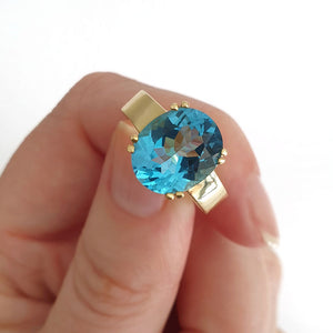 Large Oval Cut Blue Topaz And Yellow Gold Ring