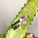 Lightly Crimped Oval Cut Morganite and Diamond Highlight Ring