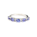 Half Eternity Oval Cut Tanzanite and Diamond Highlight Ring
