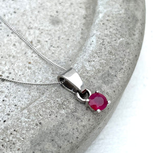 Petite Round Cut Ruby Four Claw Pendant